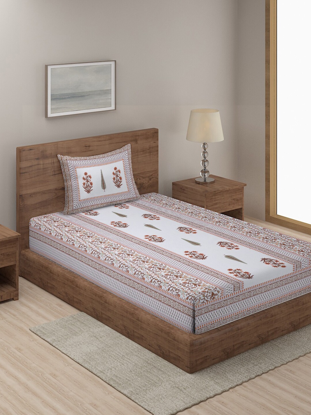 Rajasthan Decor White & Orange Printed 144 TC Single Bedsheet With 1 Pillow Cover
Rajasthan Decor White & Orange Printed 144 TC Single Bedsheet With 1 Pillow Cover