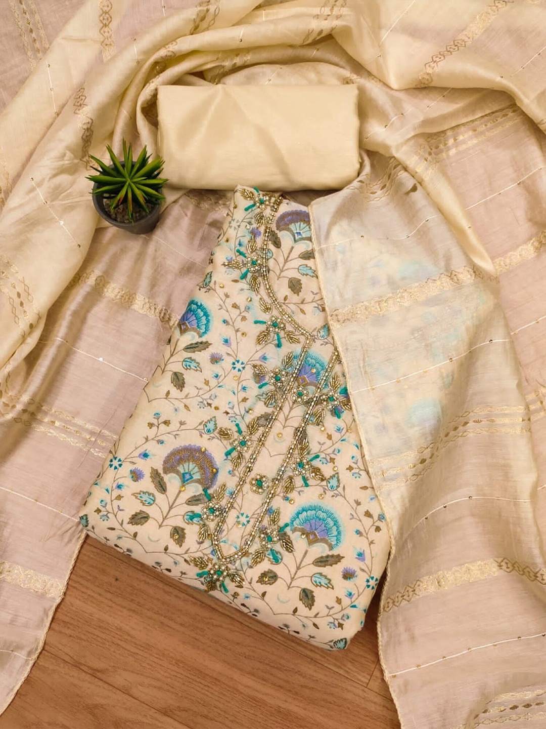Panzora Floral Printed Beads and Stones Chanderi Silk Unstitched Dress Material, Beige
Panzora Floral Printed Beads and Stones Chanderi Silk Unstitched Dress Material, Beige