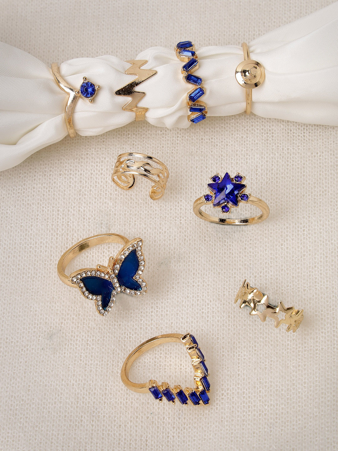 Scintillare By Sukkhi Set Of 9 Rose Gold Plated Stone Studded Adjustable Finger Rings
Scintillare By Sukkhi Set Of 9 Rose Gold Plated Stone Studded Adjustable Finger Rings