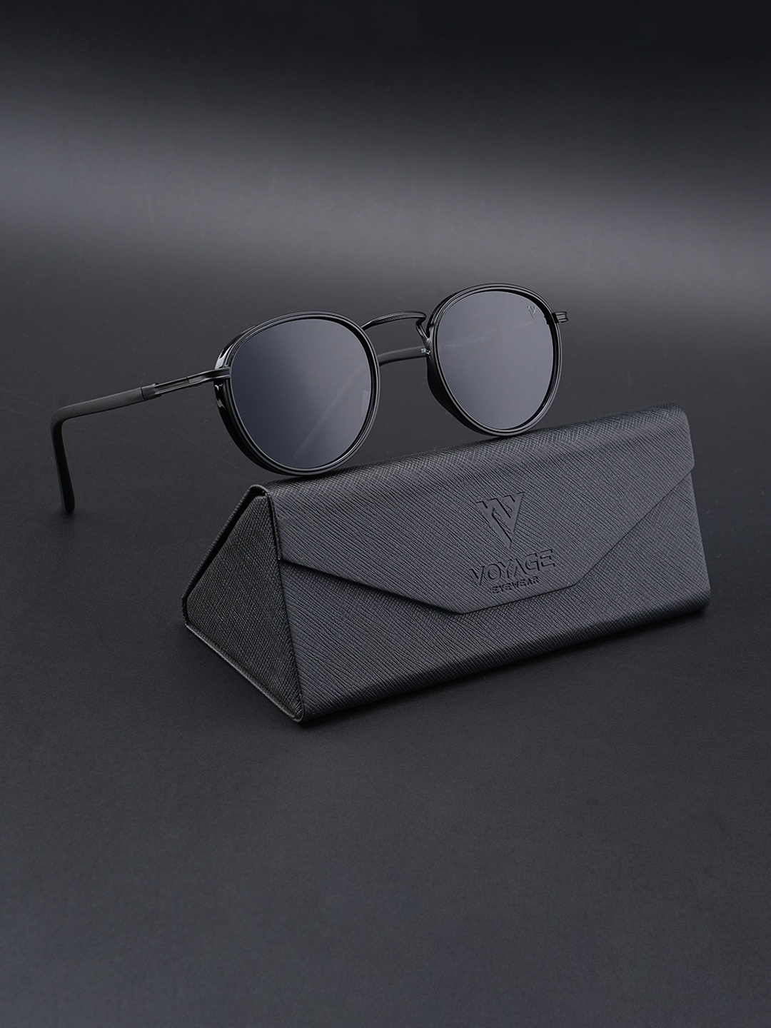 Voyage Unisex Black Lens & Black Round Sunglasses with Polarised and UV Protected Lens
Voyage Unisex Black Lens & Black Round Sunglasses with Polarised and UV Protected Lens