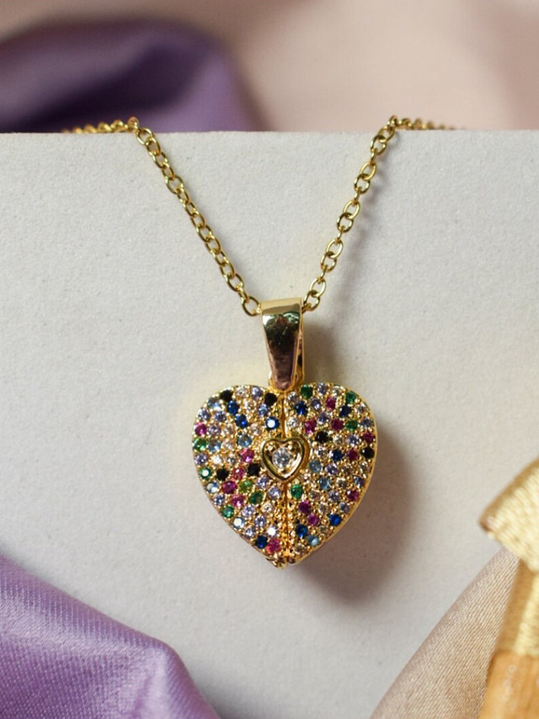 DressBerry Gold-Toned Gold-Plated Heart Shaped Stainless Steel Artificial Stone Studded Pendant with Chain
DressBerry Gold-Toned Gold-Plated Heart Shaped Stainless Steel Artificial Stone Studded Pendant with Chain