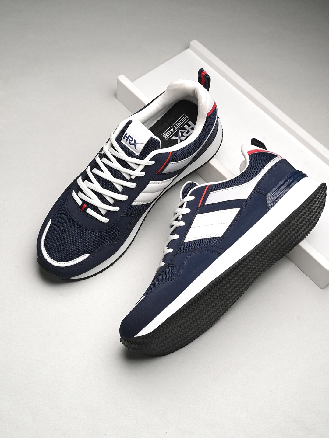 HRX by Hrithik Roshan Men Navy Blue & White Heritage Colourblocked Mesh Comfort Sneakers
HRX by Hrithik Roshan Men Navy Blue & White Heritage Colourblocked Mesh Comfort Sneakers