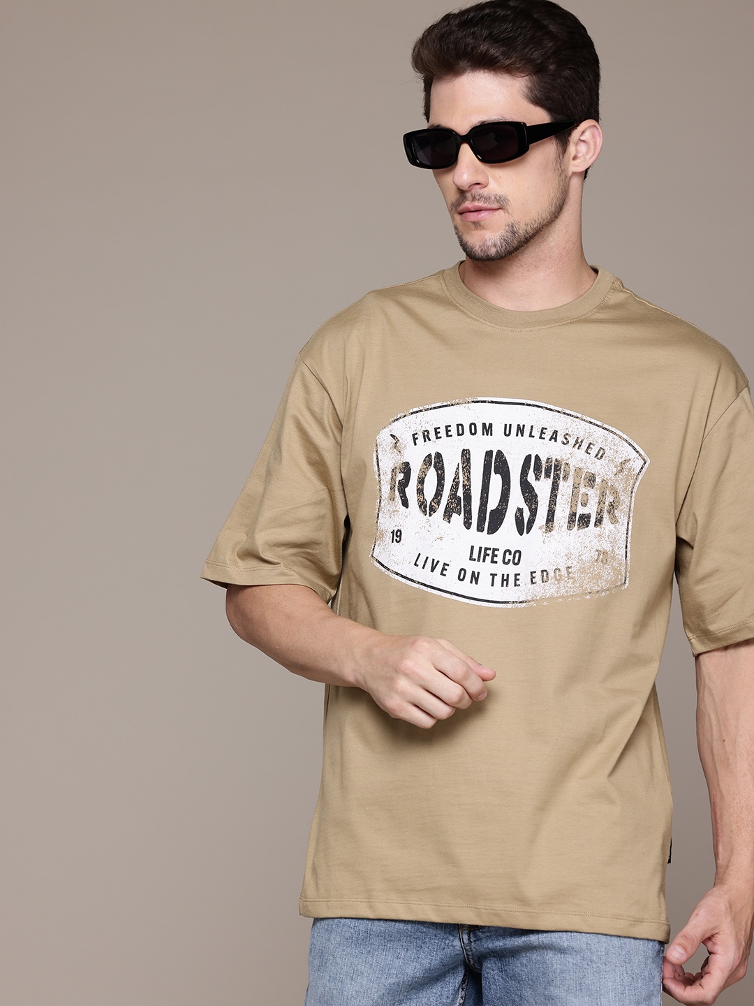 The Roadster Lifestyle Co. Printed Drop-Shoulder Sleeves Pure Cotton Relaxed T-shirt, Beige
The Roadster Lifestyle Co. Printed Drop-Shoulder Sleeves Pure Cotton Relaxed T-shirt, Beige