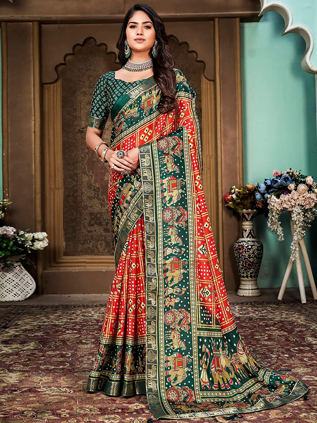 Mitera Red & Green Bandhani Printed Zari Silk Cotton Saree 
Mitera Red & Green Bandhani Printed Zari Silk Cotton Saree