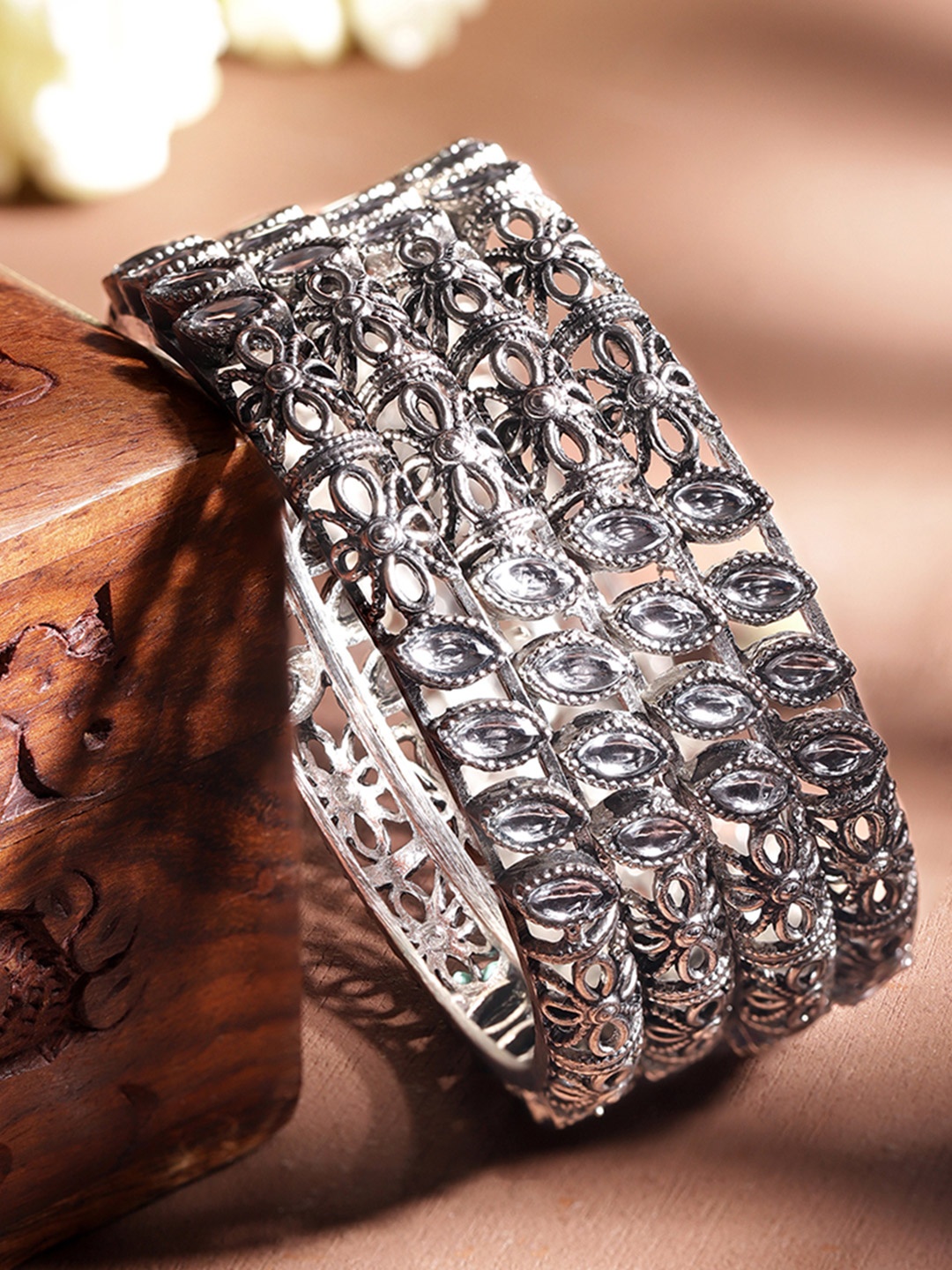 Rubans Set of 4 Silver Plated Antique Silver Tone Kundan Studded Flower Design Bangles
Rubans Set of 4 Silver Plated Antique Silver Tone Kundan Studded Flower Design Bangles