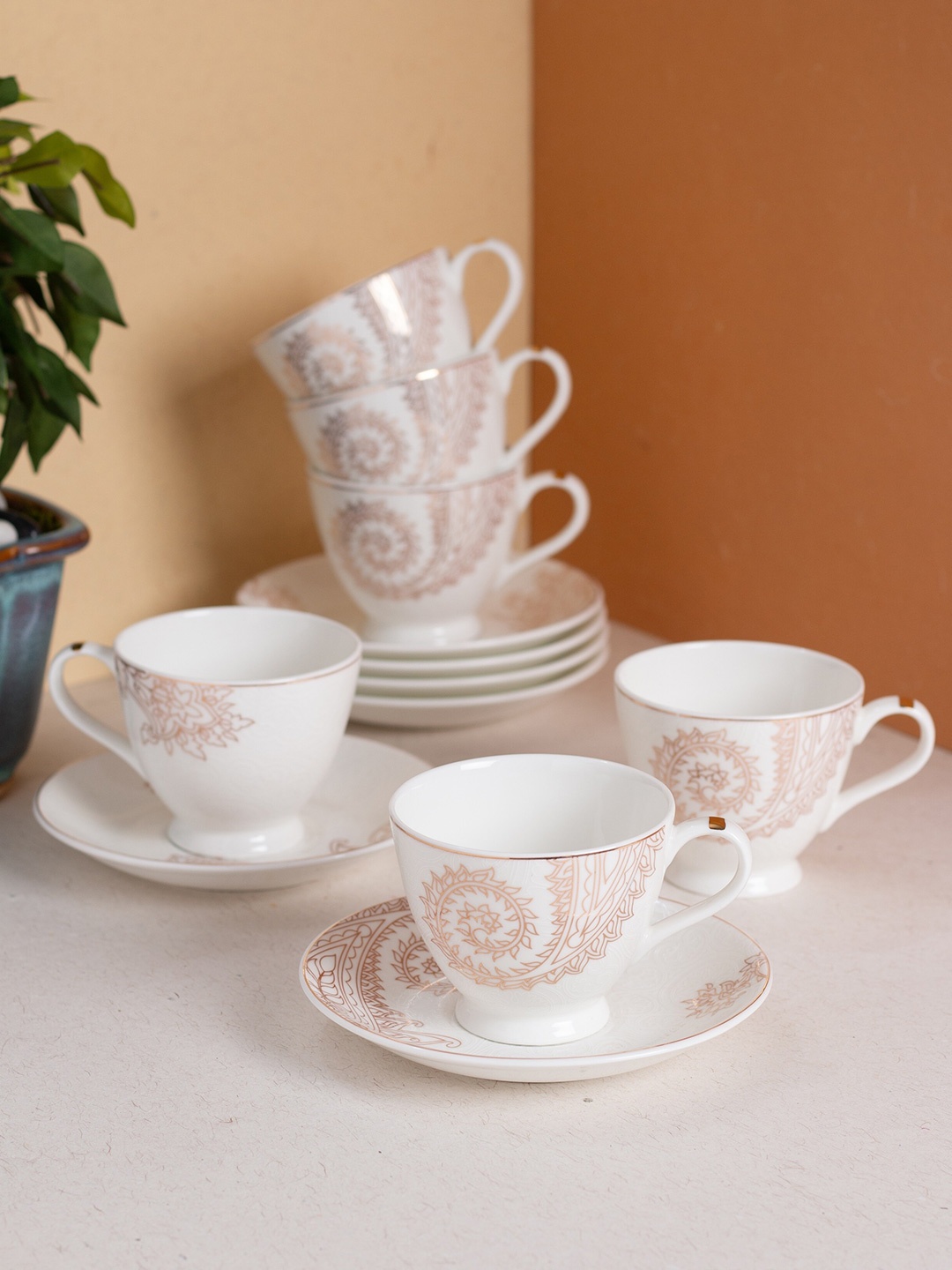 JCPL White & Cream 12 Pieces Ethnic Motifs Printed Ceramic Glossy Cups and Saucers 180 ml
JCPL White & Cream 12 Pieces Ethnic Motifs Printed Ceramic Glossy Cups and Saucers 180 ml