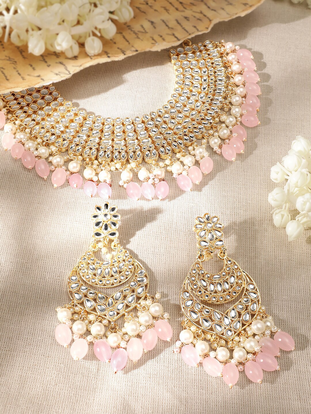 Rubans 22K Gold Plated Kundan Stone Studded Pearl Beaded Handcrafted Choker Necklace Set
Rubans 22K Gold Plated Kundan Stone Studded Pearl Beaded Handcrafted Choker Necklace Set