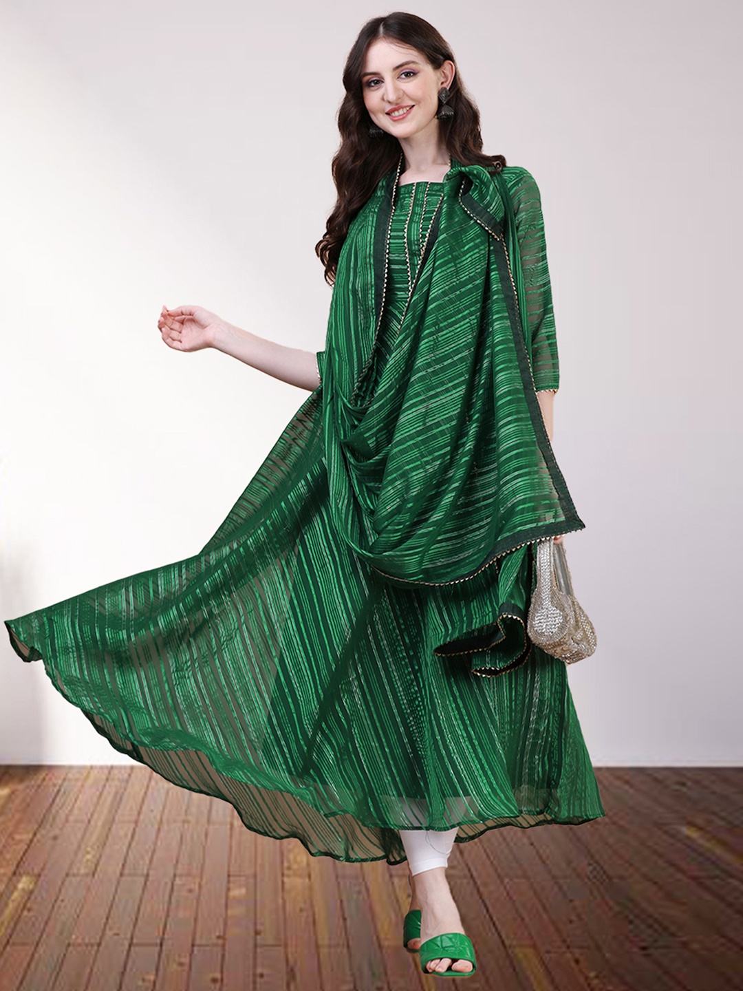 N N ENTERPRISE Ethnic Motifs Striped Empire Silk Georgette Kurti with Trousers & Dupatta, Green
N N ENTERPRISE Ethnic Motifs Striped Empire Silk Georgette Kurti with Trousers & Dupatta, Green