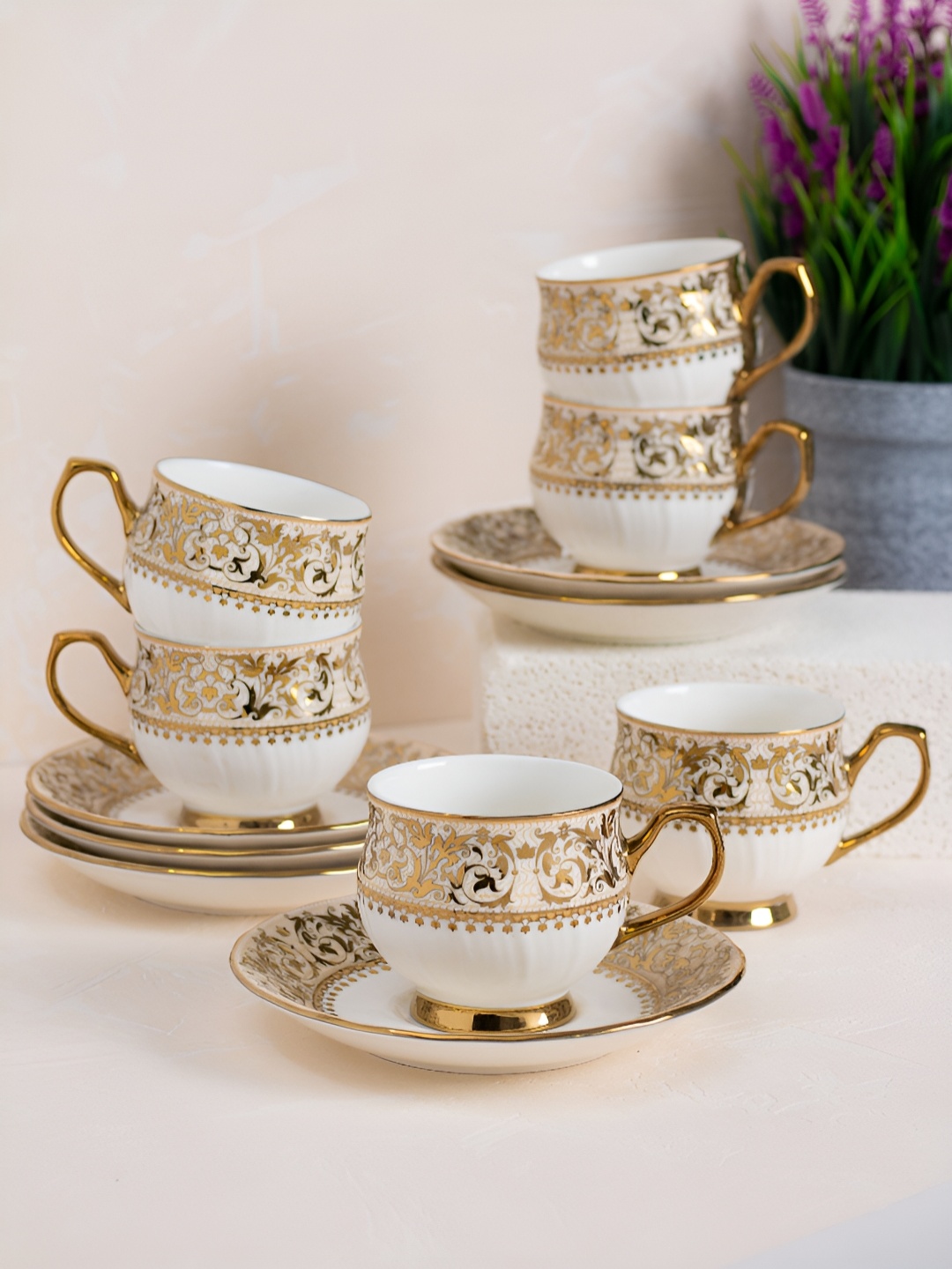 JCPL White & Gold Toned 12 Pieces Printed Ceramic Glossy Cups And Saucers 180 ml Each
JCPL White & Gold Toned 12 Pieces Printed Ceramic Glossy Cups And Saucers 180 ml Each