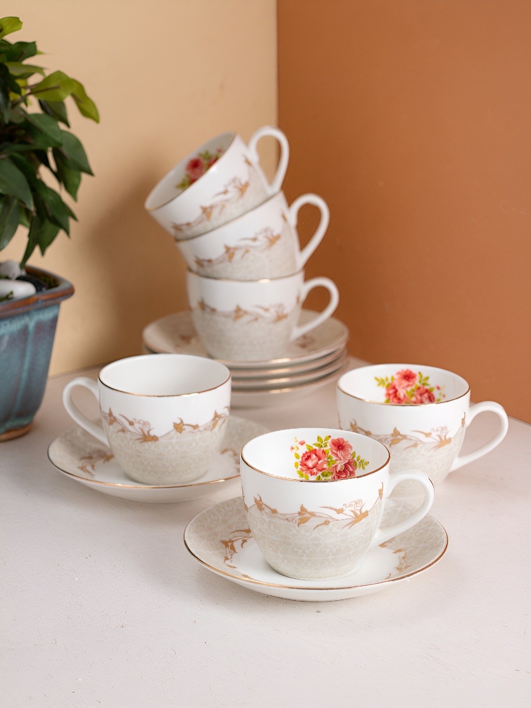 JCPL White & Red Floral 12 Pieces Printed Ceramic Glossy Cups and Saucers 180 ml Each
JCPL White & Red Floral 12 Pieces Printed Ceramic Glossy Cups and Saucers 180 ml Each