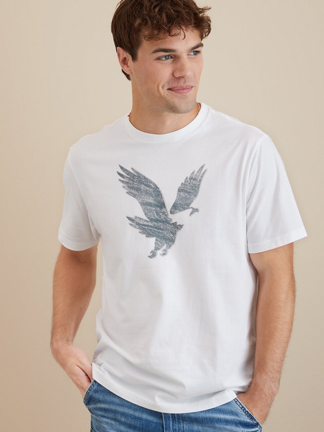 AMERICAN EAGLE OUTFITTERS Graphic Printed Round Neck Half Sleeves Cotton T-shirt, White
AMERICAN EAGLE OUTFITTERS Graphic Printed Round Neck Half Sleeves Cotton T-shirt, White