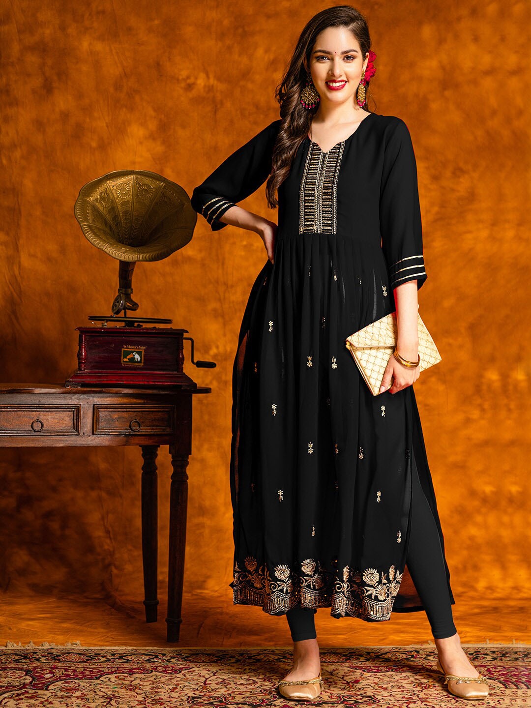 KALINI Embroidered Sequined Semi Sheer Naira Cut A-line Georgette Kurta with Trousers, Black
KALINI Embroidered Sequined Semi Sheer Naira Cut A-line Georgette Kurta with Trousers, Black