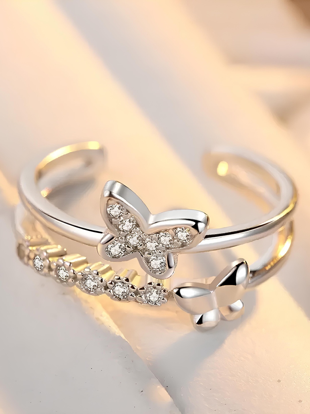 KARISHMA KREATIONS Set Of 2 Silver-Plated Cubic Zirconia-Studded Adjustable Finger Rings
KARISHMA KREATIONS Set Of 2 Silver-Plated Cubic Zirconia-Studded Adjustable Finger Rings