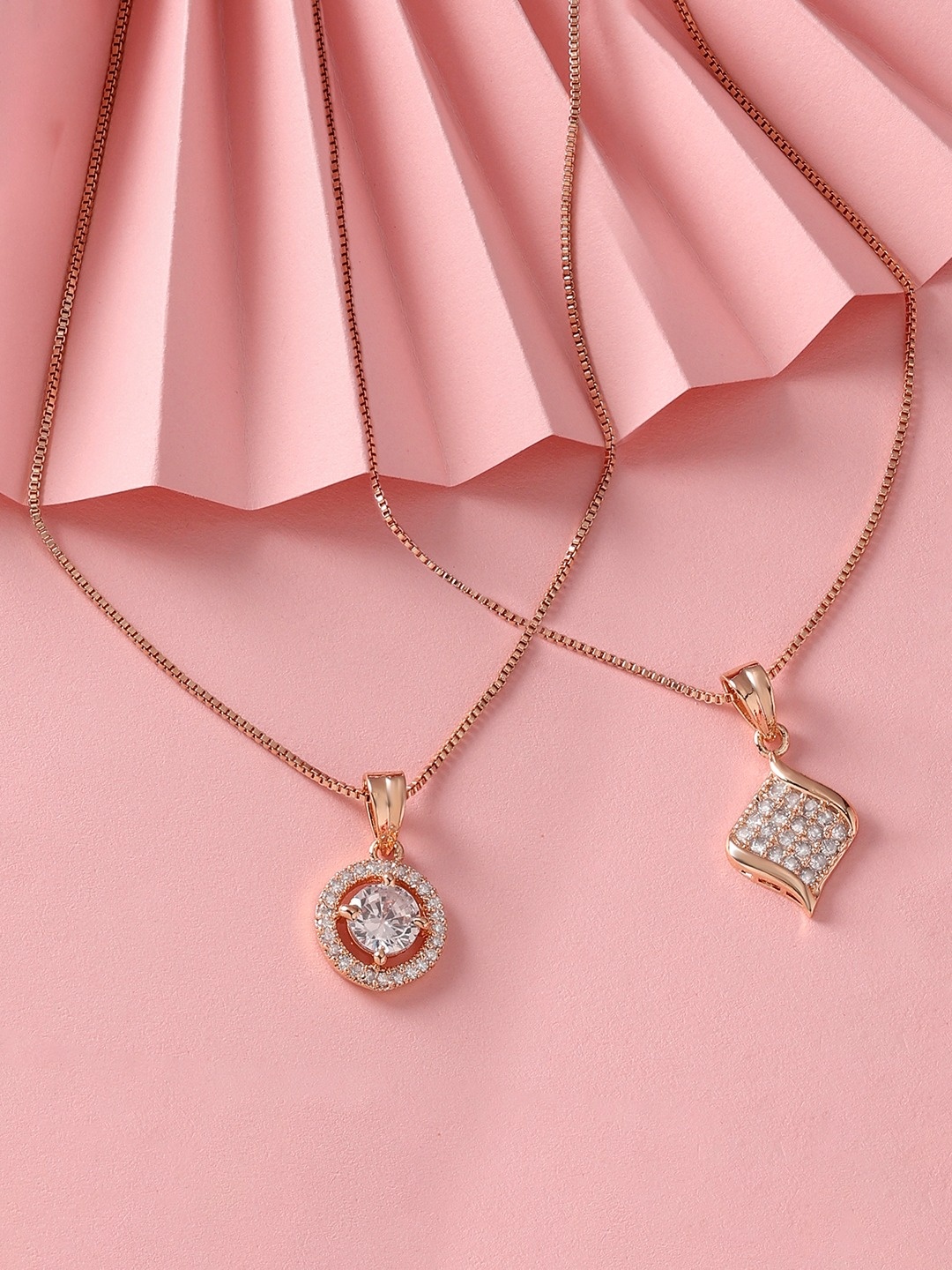 Zaveri Pearls Set of 2 Rose Gold-Plated Cubic Zirconia Studded Pendants with Chains
Zaveri Pearls Set of 2 Rose Gold-Plated Cubic Zirconia Studded Pendants with Chains