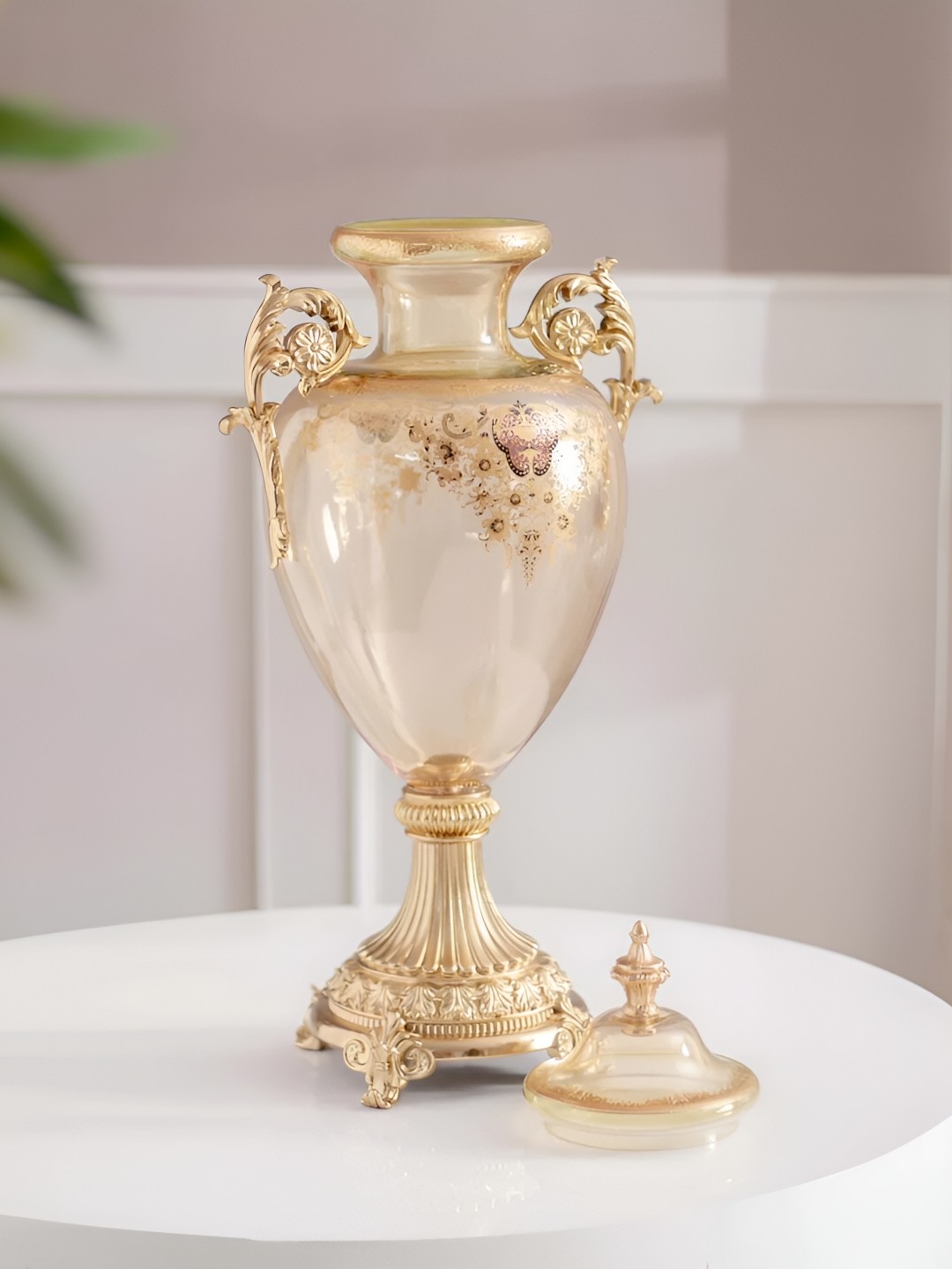 THEDECORKART Transparent & Gold Toned Floral Printed Ornate Shape Glass Vase With Lid
THEDECORKART Transparent & Gold Toned Floral Printed Ornate Shape Glass Vase With Lid