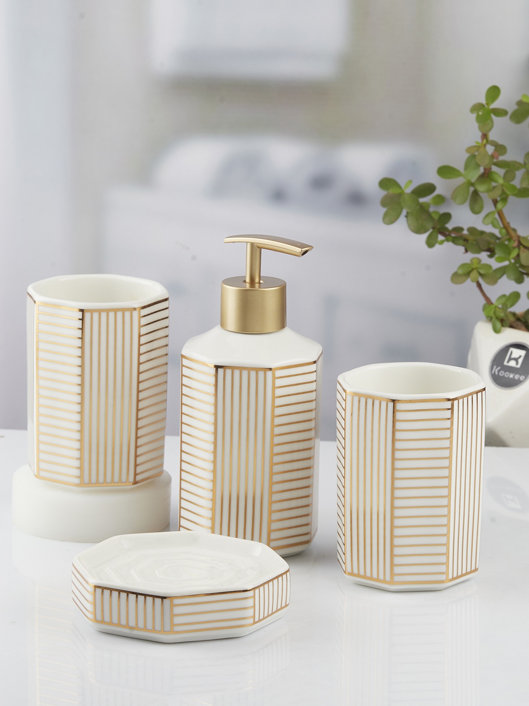 Kookee White & Gold Toned 4 Piece Abstract Ceramic Bath Accessories Set
Kookee White & Gold Toned 4 Piece Abstract Ceramic Bath Accessories Set