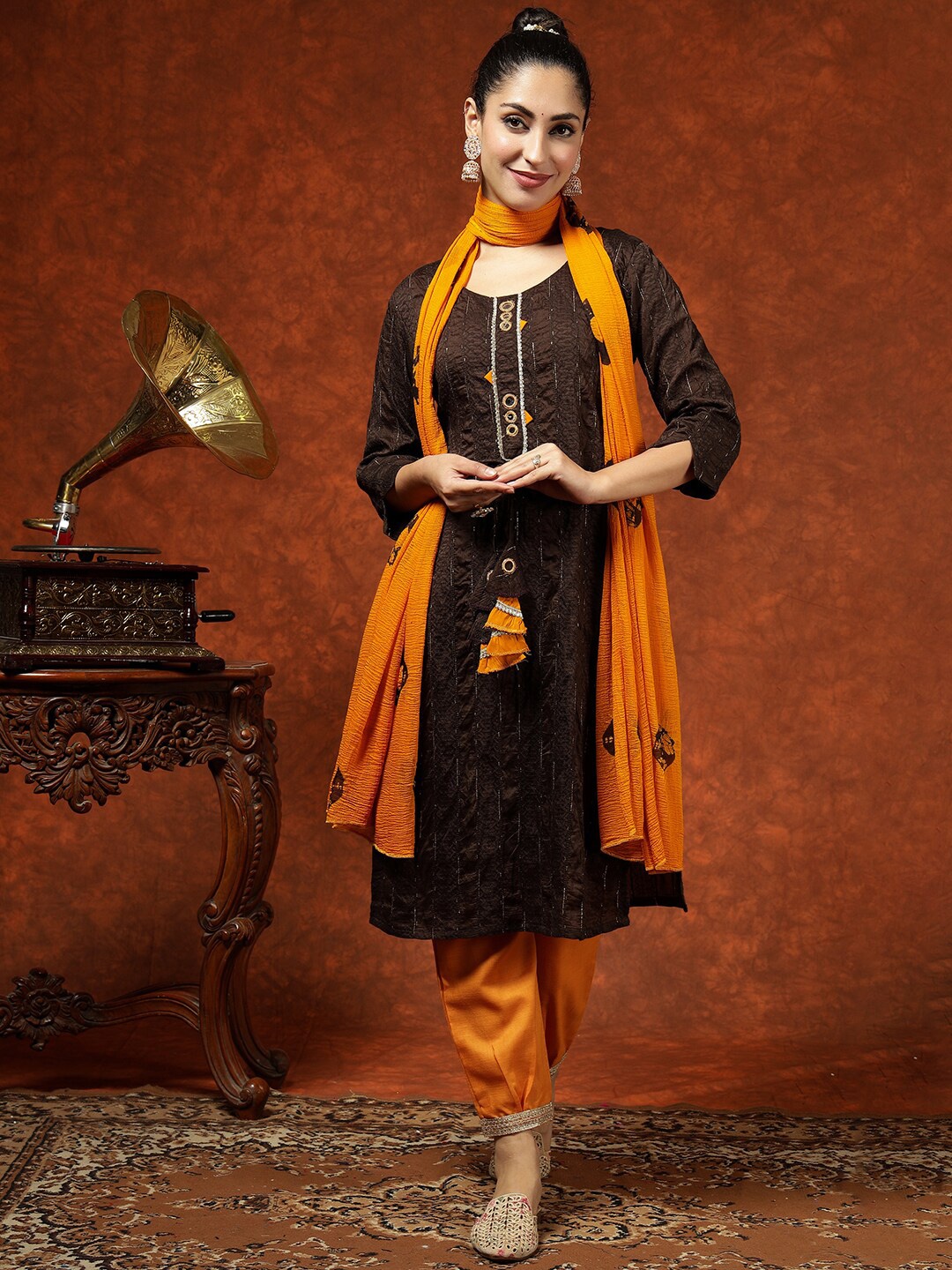 KALINI Ethnic Motifs Embroidered Mirror Work Chanderi Silk Kurta with Trousers & Dupatta, Brown
KALINI Ethnic Motifs Embroidered Mirror Work Chanderi Silk Kurta with Trousers & Dupatta, Brown