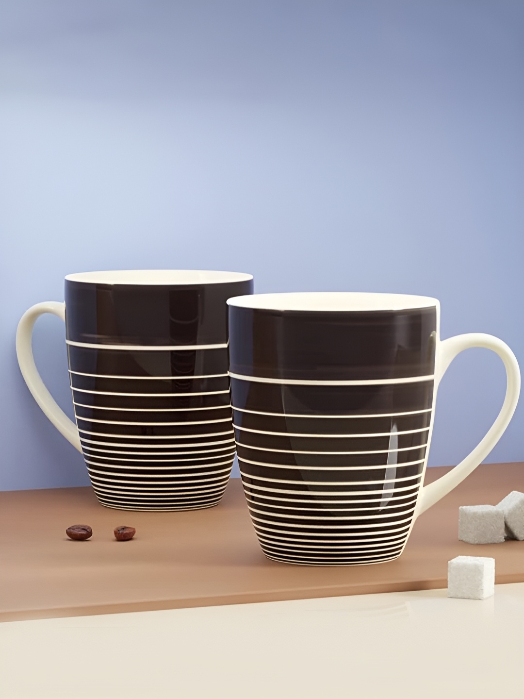 The Earth Store Brown 2 Pcs Printed Microwave Safe Glossy Finish Ceramic Mugs 280 ml Each
The Earth Store Brown 2 Pcs Printed Microwave Safe Glossy Finish Ceramic Mugs 280 ml Each