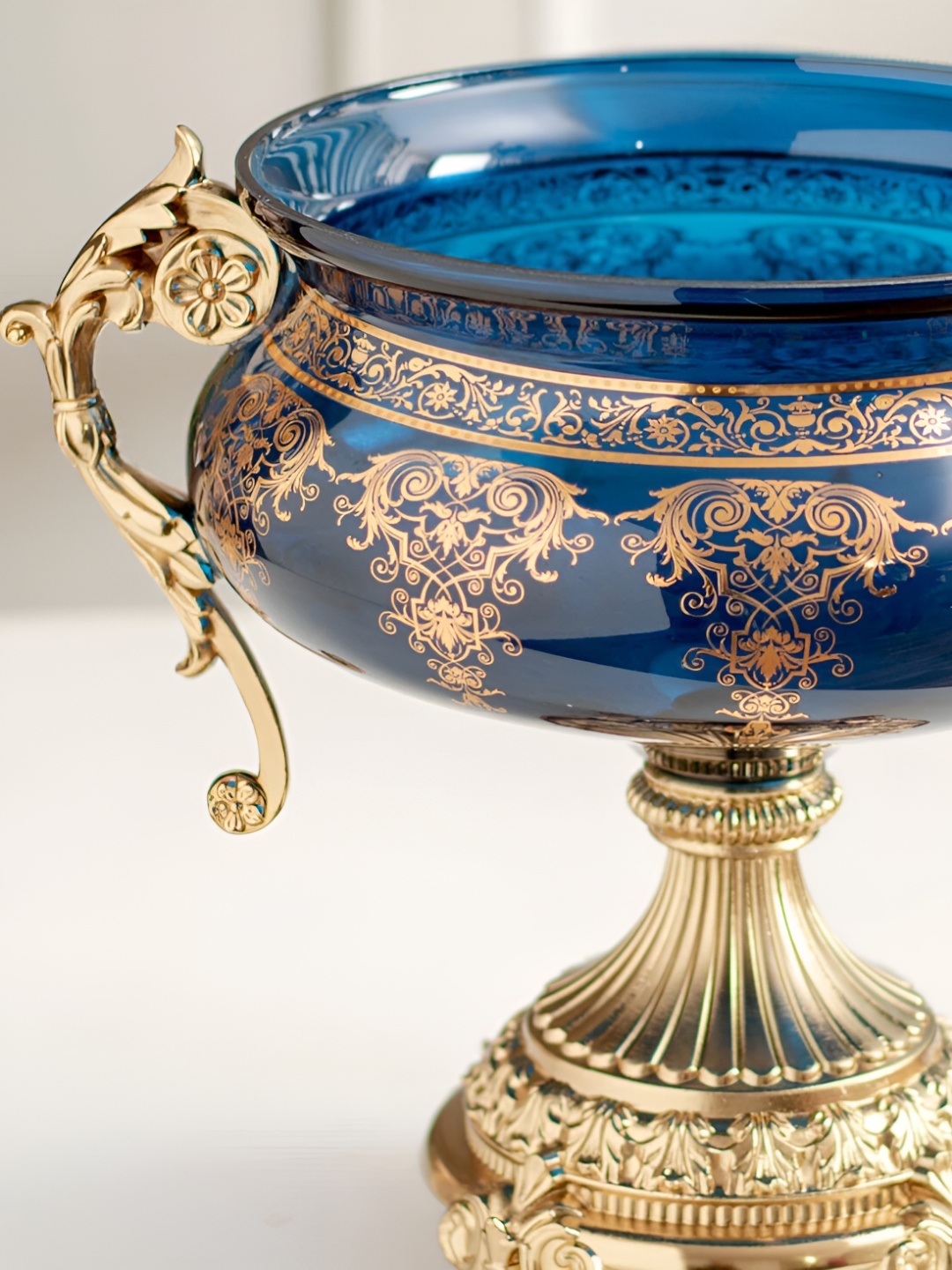 THEDECORKART Blue & Gold Toned Printed Glass Curio Showpiece