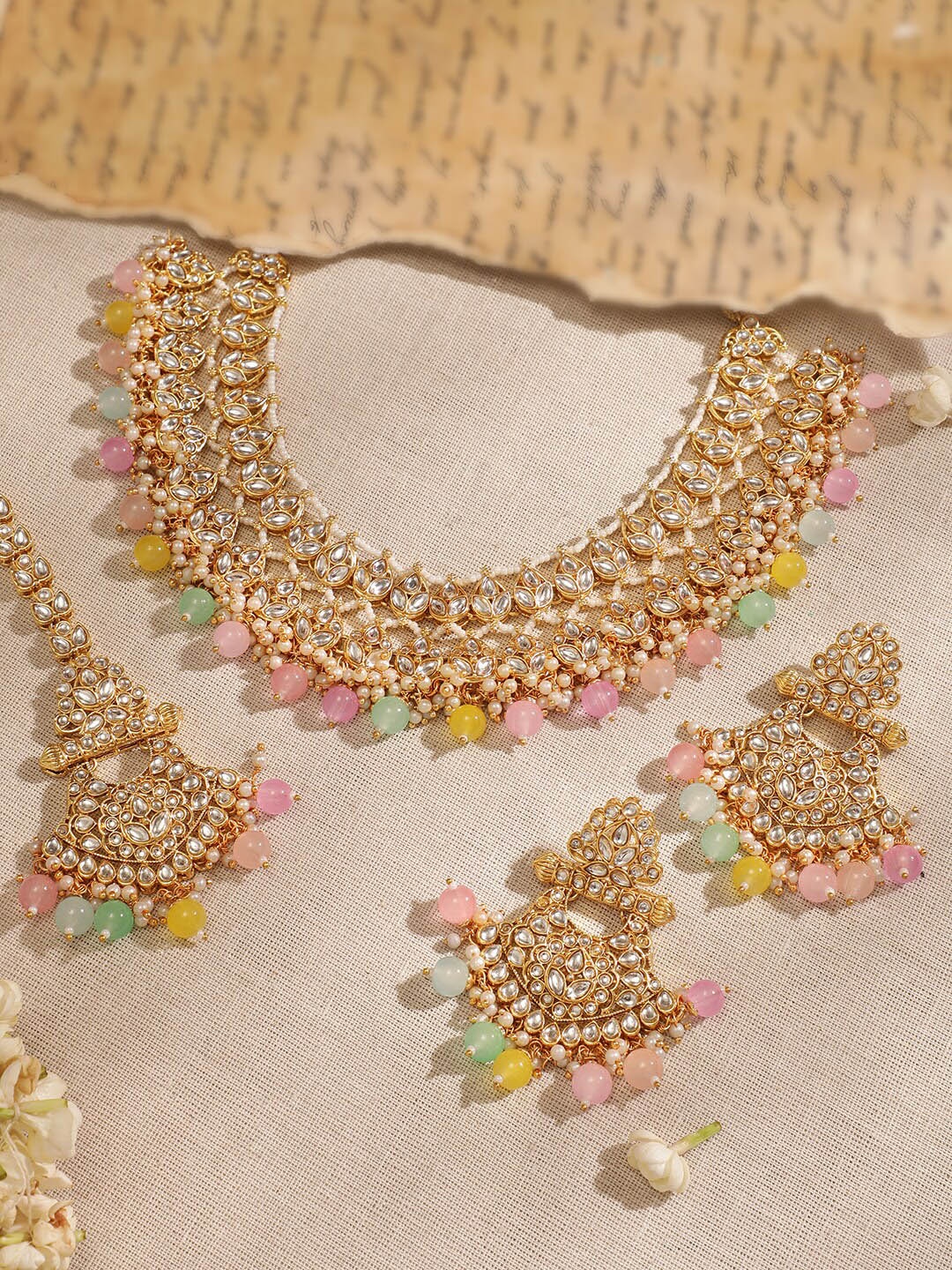 Rubans 22K Gold Plated Kundan Studded Multicolor Pearl Beaded Traditional Jewellery Set
Rubans 22K Gold Plated Kundan Studded Multicolor Pearl Beaded Traditional Jewellery Set