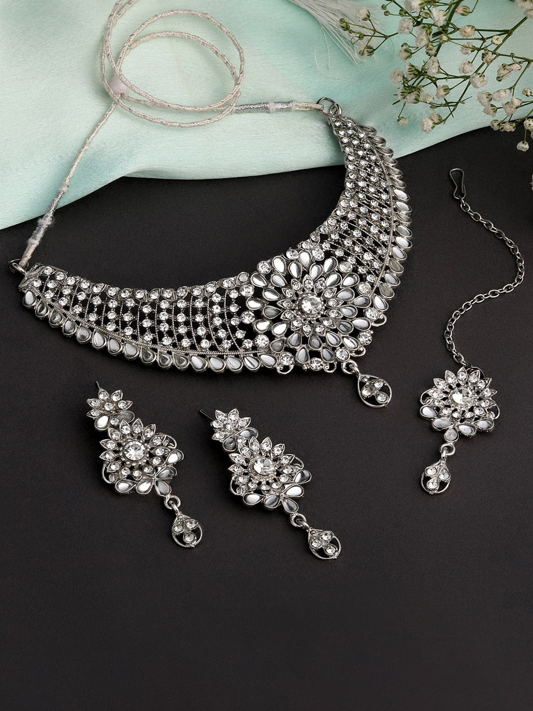 Shining Diva Silver Plated American Diamond Studded Necklace & Earrings With Maang Tika
Shining Diva Silver Plated American Diamond Studded Necklace & Earrings With Maang Tika