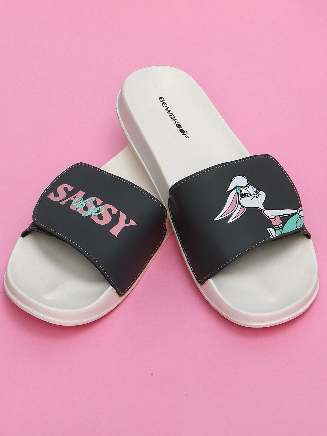 Bewakoof LOONEY TUNES Women Looney Tunes Printed Rubber Sliders, White 
Bewakoof LOONEY TUNES Women Looney Tunes Printed Rubber Sliders, White