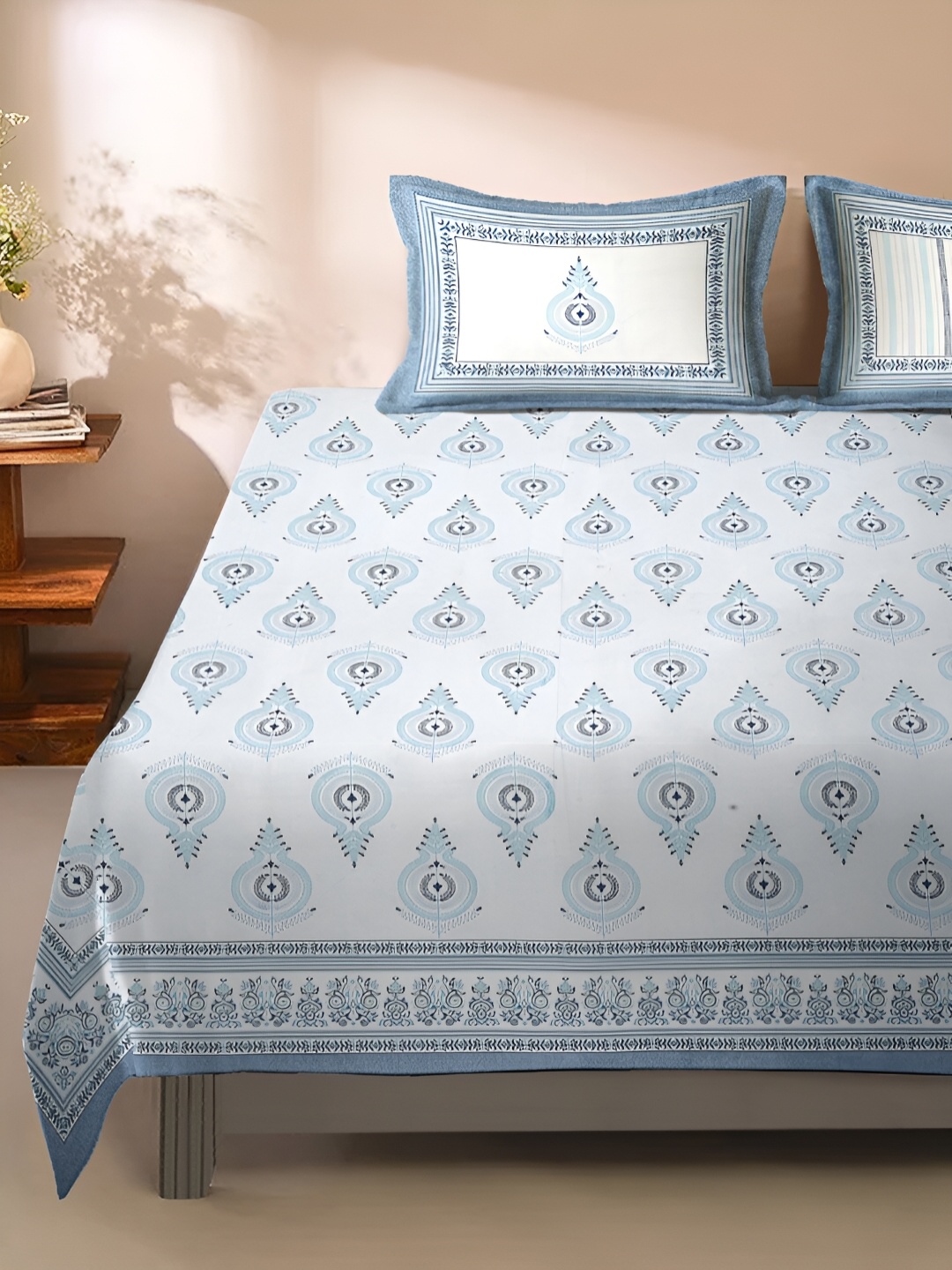 Rajasthan Decor Off White & Blue Ethnic Motifs 180 TC Cotton Bedsheet with 2 Pillow Covers
Rajasthan Decor Off White & Blue Ethnic Motifs 180 TC Cotton Bedsheet with 2 Pillow Covers