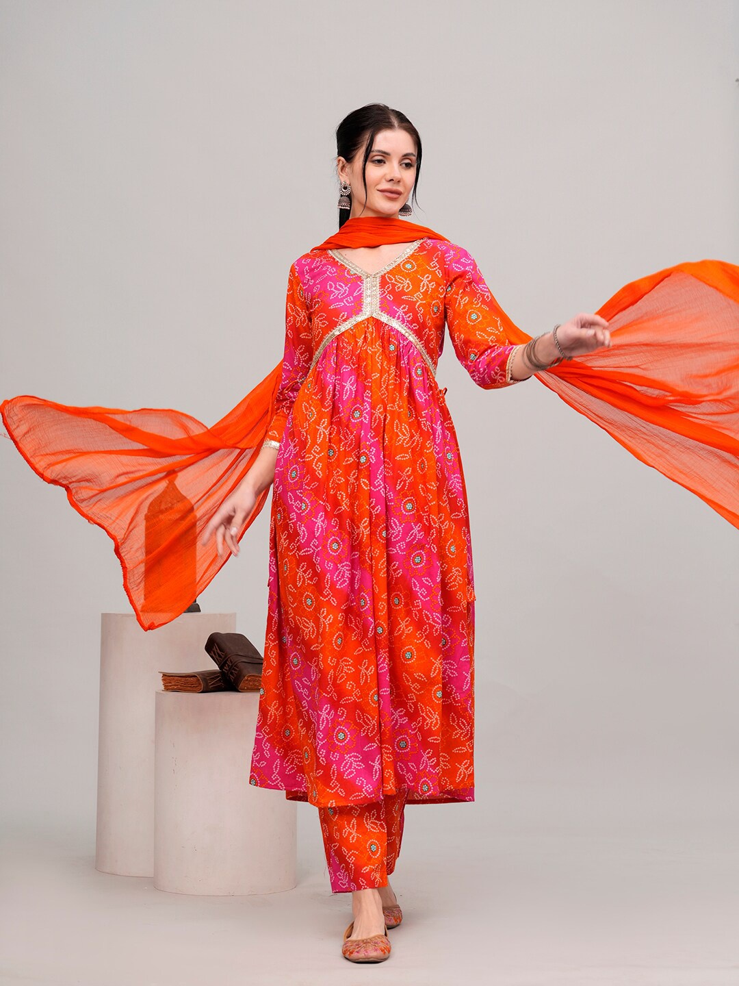 SHIONS Bandhani Printed V-Nek Empire Pure Cotton Anarkali Kurta with Trousers & Dupatta, Orange
SHIONS Bandhani Printed V-Nek Empire Pure Cotton Anarkali Kurta with Trousers & Dupatta, Orange
