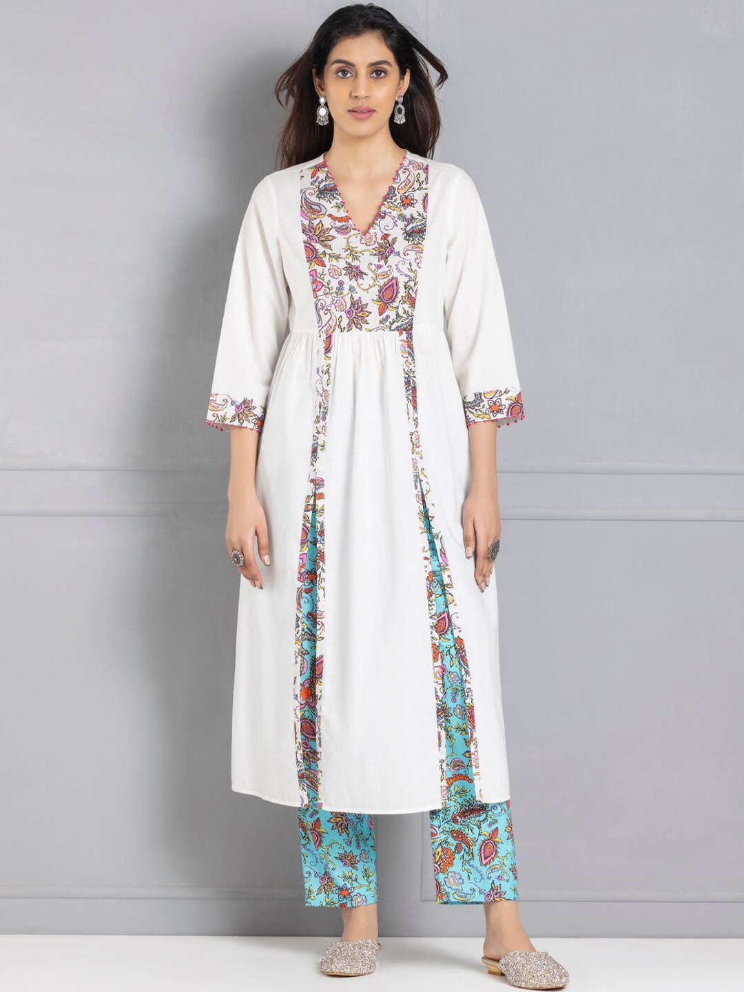 SHAYE Floral Printed V-Neck High Slit Beads and Stones Pure Cotton Kurta with Trousers, White
SHAYE Floral Printed V-Neck High Slit Beads and Stones Pure Cotton Kurta with Trousers, White