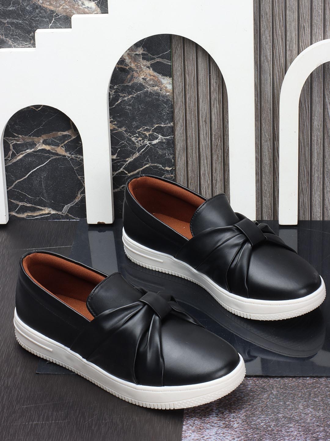 The Roadster Lifestyle Co. Women Black Round Toe Slip-On Sneakers With Bow Detail
The Roadster Lifestyle Co. Women Black Round Toe Slip-On Sneakers With Bow Detail
