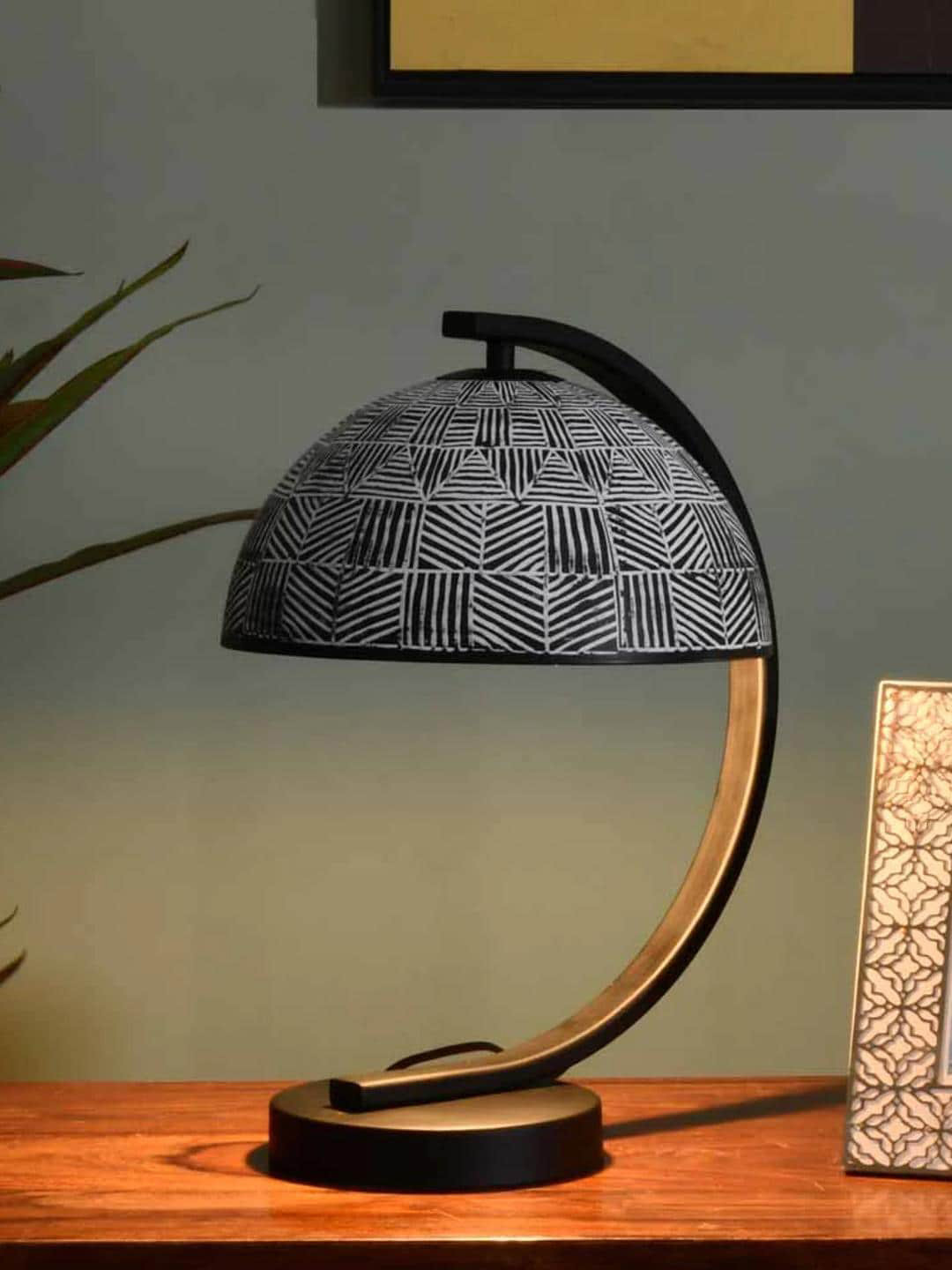 Athome by Nilkamal Calathus Arch Black Textured Semi-Spherical Shaped Metal Table Lamp
Athome by Nilkamal Calathus Arch Black Textured Semi-Spherical Shaped Metal Table Lamp