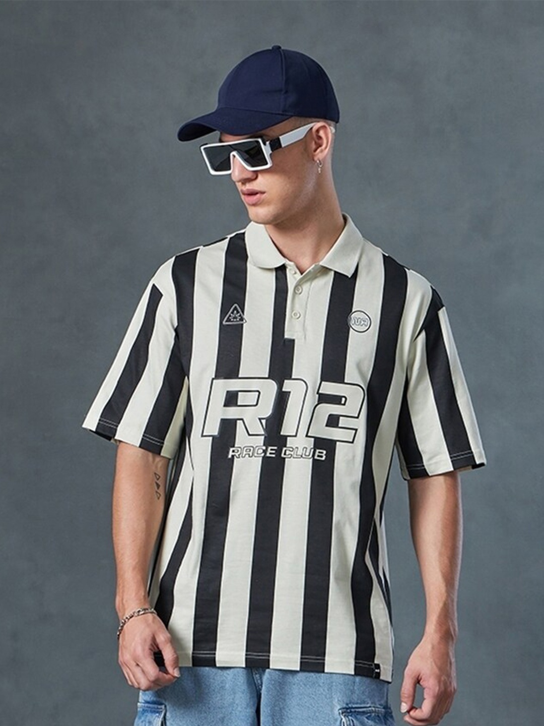 Bewakoof White R12 Race Club Striped Polo Collar Short Sleeves Cotton Oversized T-shirt, Off white
Bewakoof White R12 Race Club Striped Polo Collar Short Sleeves Cotton Oversized T-shirt, Off white