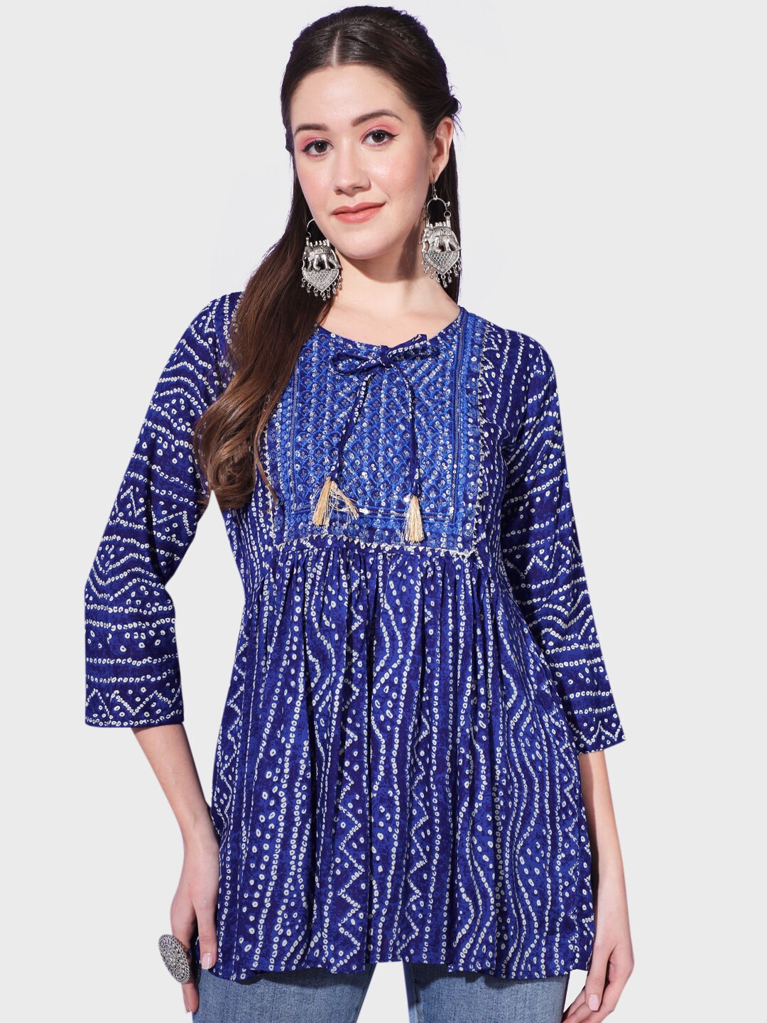 BUY NEW TREND Bandhani Printed Tie-Up Neck Sequinned Pure Cotton A-Line Kurti, Blue
BUY NEW TREND Bandhani Printed Tie-Up Neck Sequinned Pure Cotton A-Line Kurti, Blue