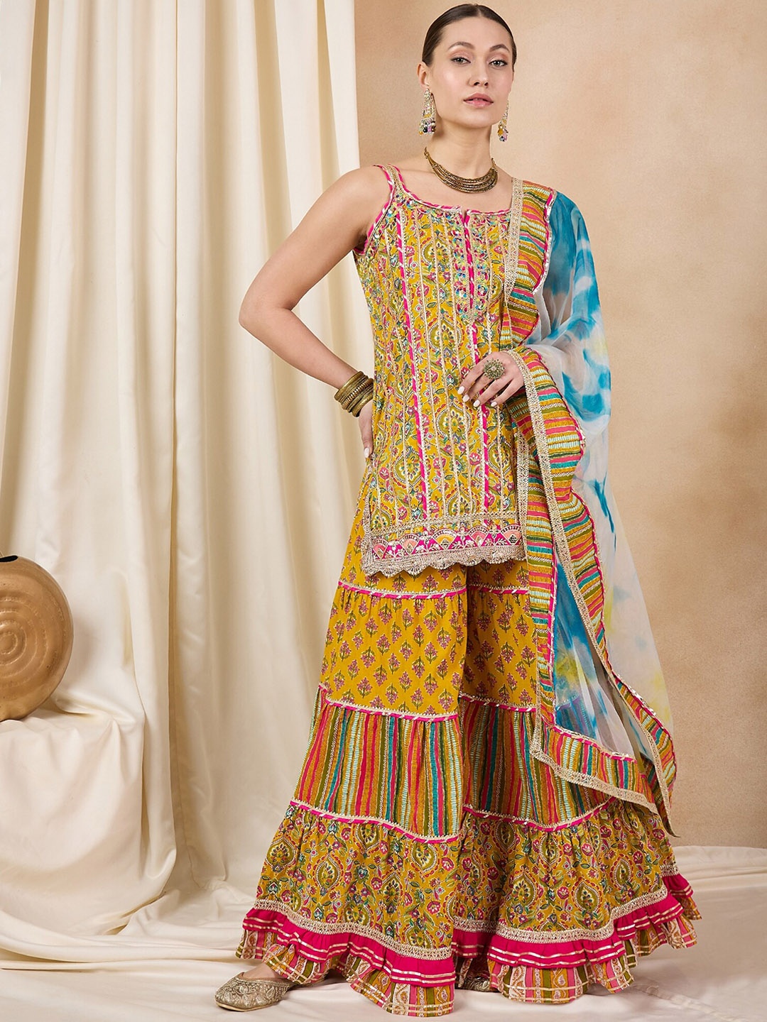 RAJGRANTH Women Ethnic Motifs Printed Regular Gotta Patti Pure Cotton Kurti with Sharara & With Dupatta, Mustard
RAJGRANTH Women Ethnic Motifs Printed Regular Gotta Patti Pure Cotton Kurti with Sharara & With Dupatta, Mustard