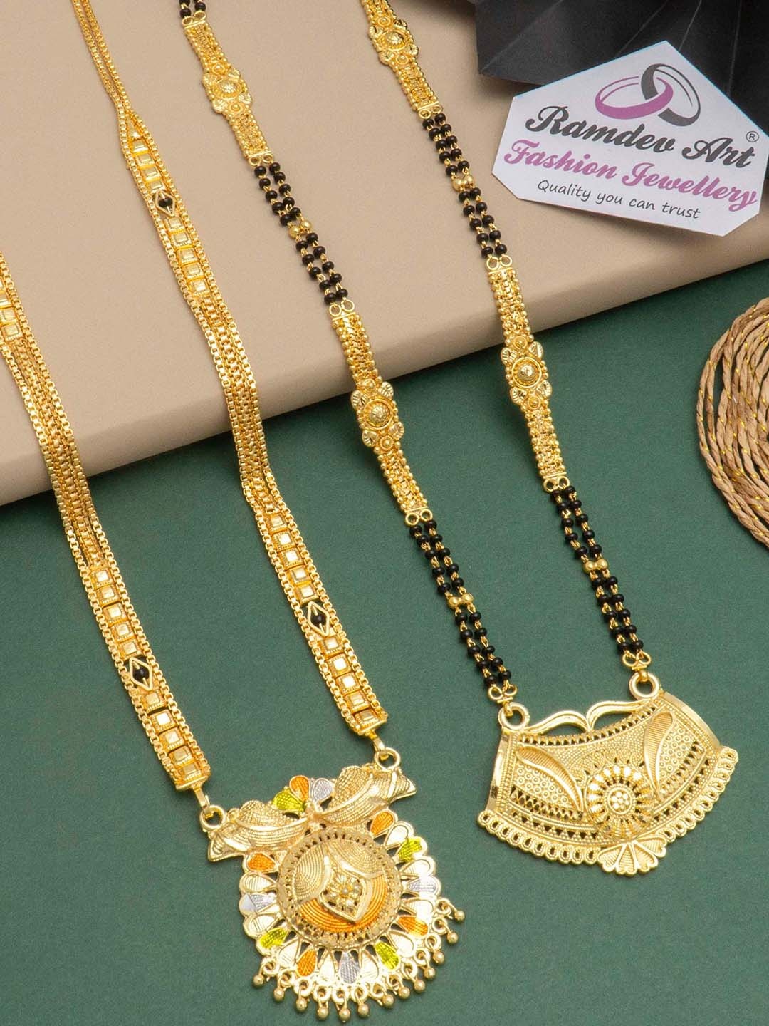 Ramdev Art Fashion Jwellery Set Of 2 Gold-Plated Stone-Studded & Beaded Mangalsutra
Ramdev Art Fashion Jwellery Set Of 2 Gold-Plated Stone-Studded & Beaded Mangalsutra