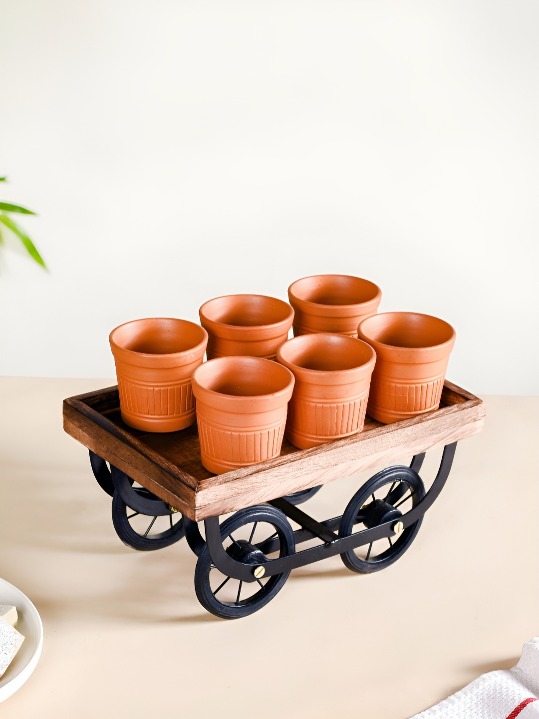 Nestasia Brown 6 Pieces Textured Terracotta Matte Kulladhs With Push Cart Platter 100 ml
Nestasia Brown 6 Pieces Textured Terracotta Matte Kulladhs With Push Cart Platter 100 ml