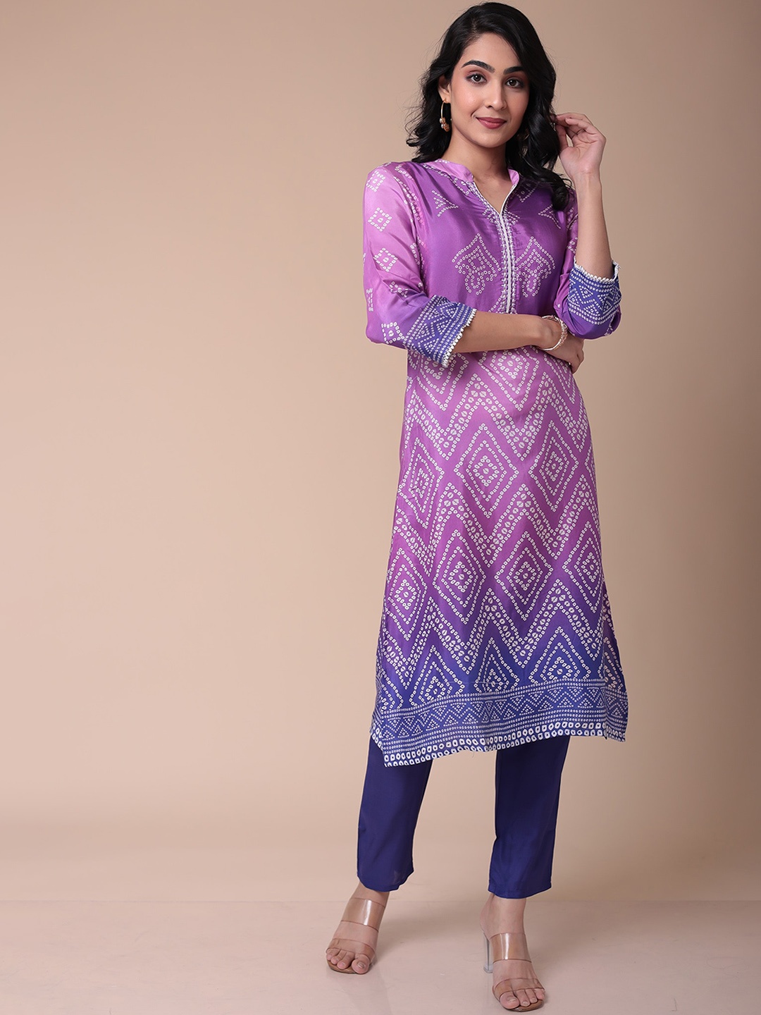 ZARI Women Bandhani Printed Thread Work Mandarin Collar Straight Kurta With Trousers, Purple
ZARI Women Bandhani Printed Thread Work Mandarin Collar Straight Kurta With Trousers, Purple