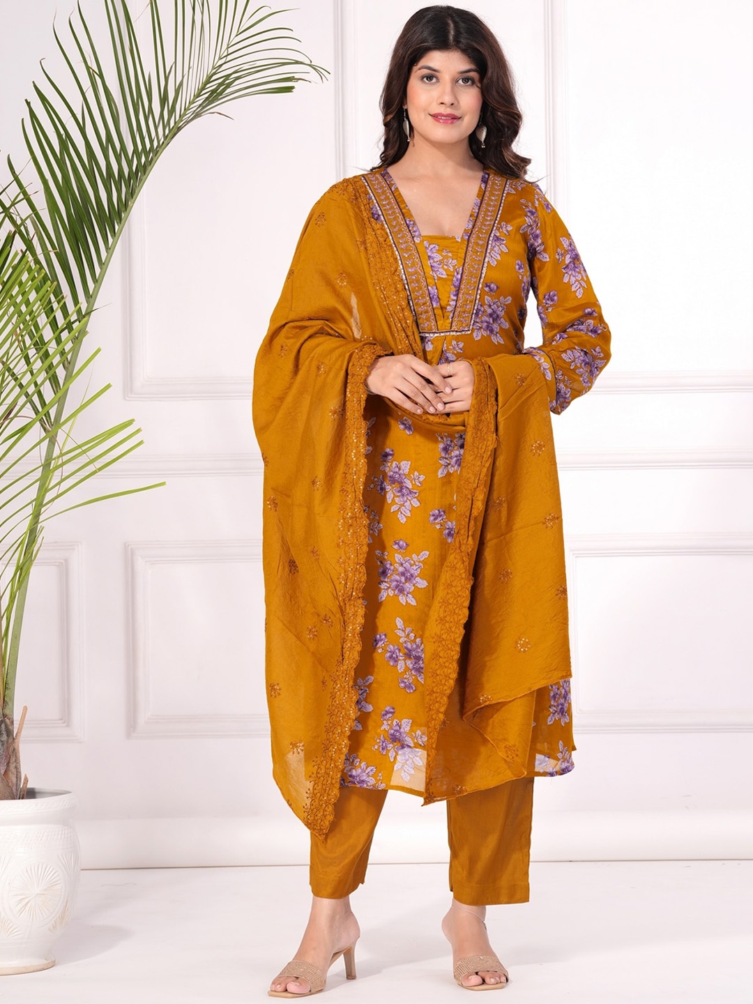 KALINI Women Floral Printed Regular Beads and Stones Kurta with Trousers & With Dupatta, Yellow
KALINI Women Floral Printed Regular Beads and Stones Kurta with Trousers & With Dupatta, Yellow