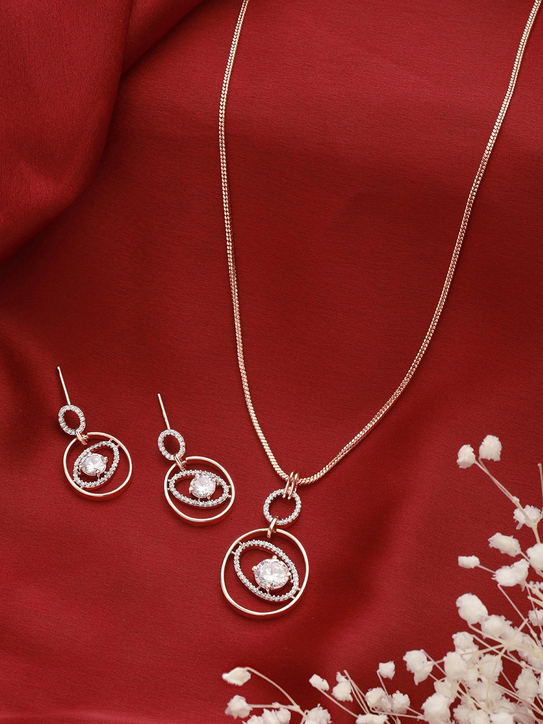 Saraf RS Jewellery Rose Gold-Plated CZ-Studded Solitaire Minimal Pendant Jewellery Set
Saraf RS Jewellery Rose Gold-Plated CZ-Studded Solitaire Minimal Pendant Jewellery Set