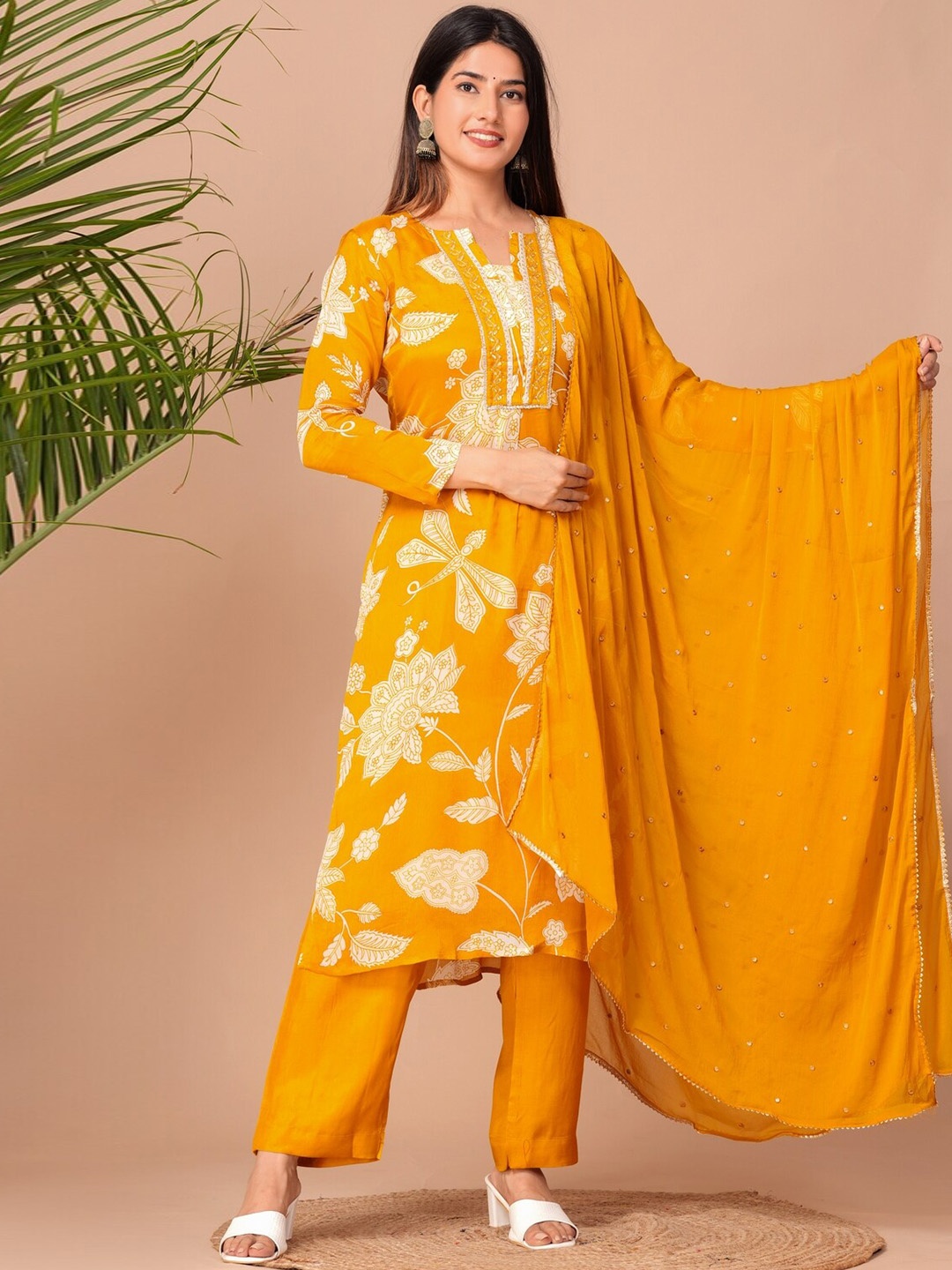KALINI Notched Neck Floral Printed Beads and Stones Kurta with Trouser & Dupatta, Yellow
KALINI Notched Neck Floral Printed Beads and Stones Kurta with Trouser & Dupatta, Yellow
