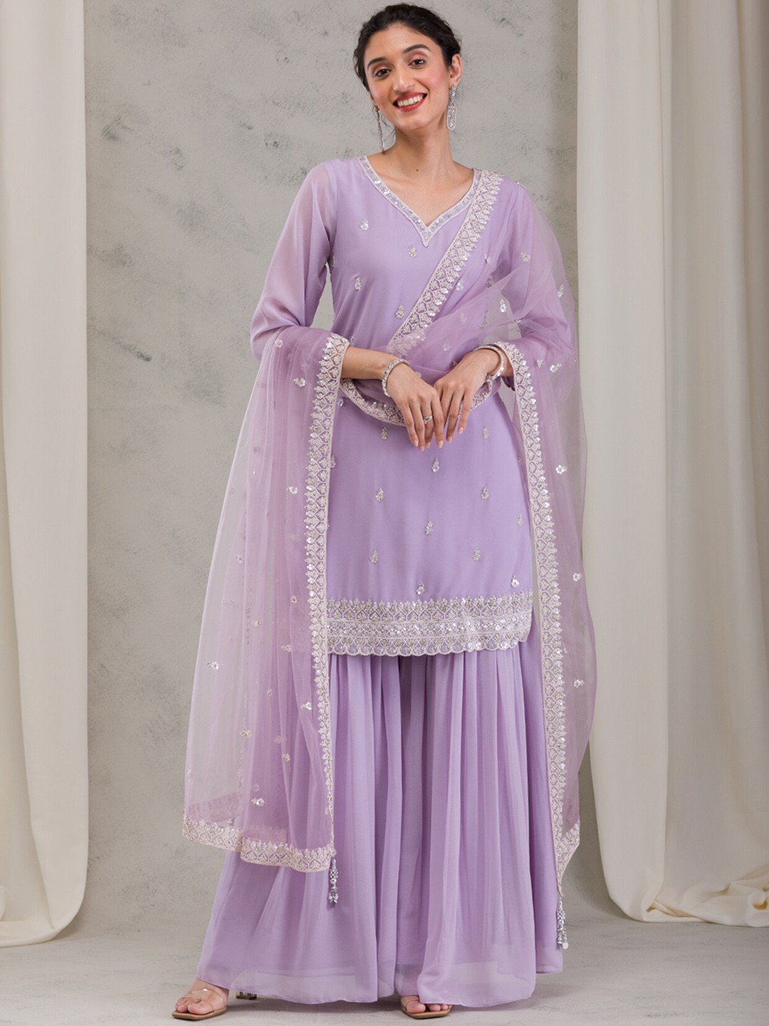 Koskii Women Ethnic Motifs Embroidered Regular Sequinned Kurta with Sharara & With Dupatta, Purple
Koskii Women Ethnic Motifs Embroidered Regular Sequinned Kurta with Sharara & With Dupatta, Purple