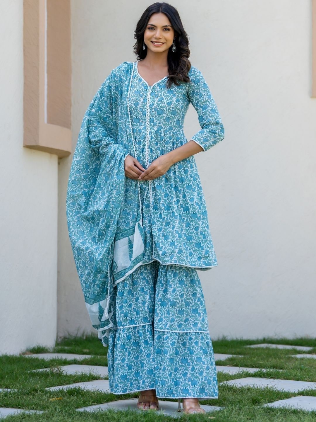 HOUSE OF JAMOTI Floral Printed V-Neck Pure Cotton A-Line Kurta with Sharara & Dupatta, Blue
HOUSE OF JAMOTI Floral Printed V-Neck Pure Cotton A-Line Kurta with Sharara & Dupatta, Blue