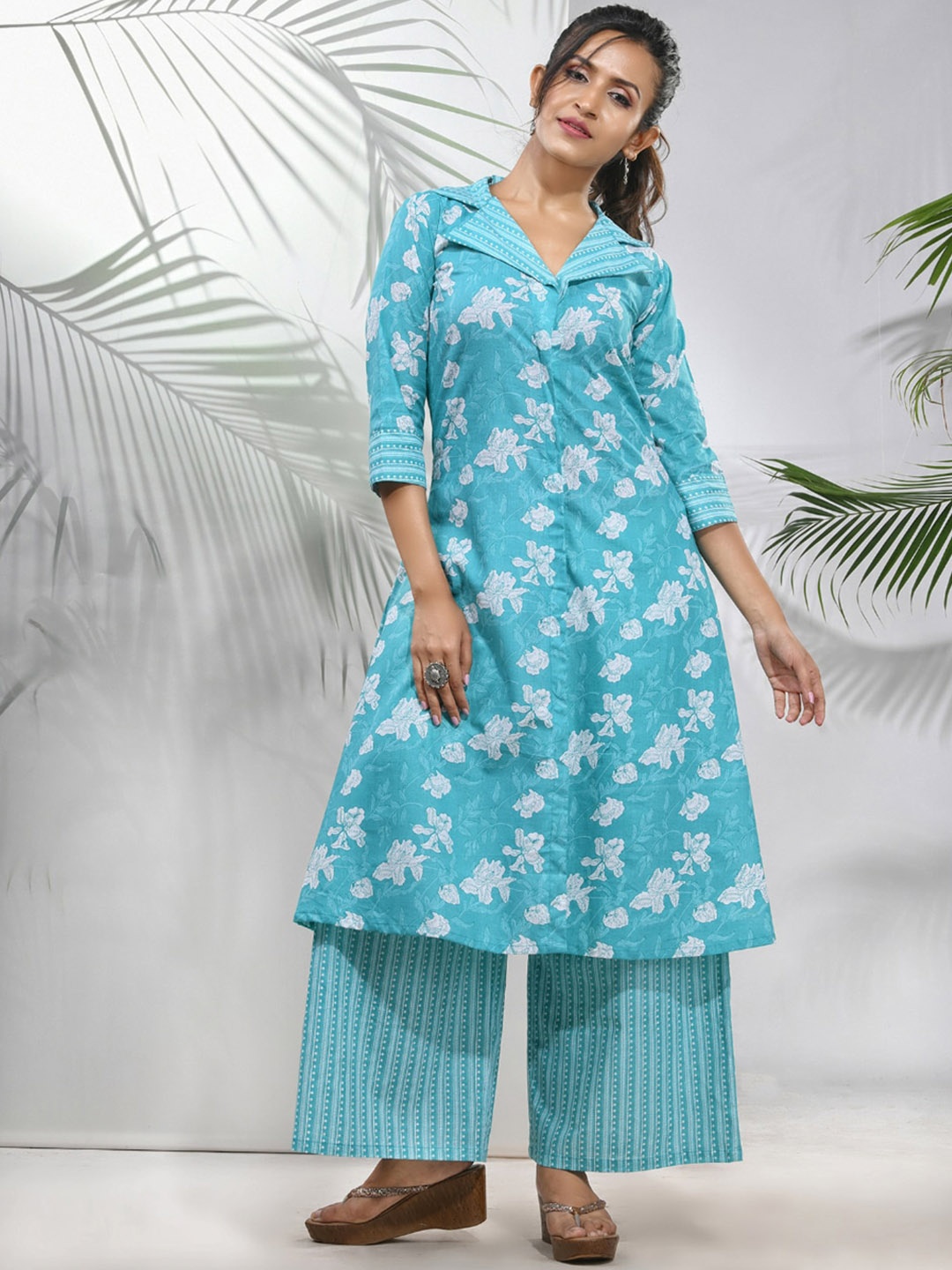 Charukriti Floral Printed Shawl Collar Three-Quarter Sleeves Cotton Kurta with Palazzos, Blue
Charukriti Floral Printed Shawl Collar Three-Quarter Sleeves Cotton Kurta with Palazzos, Blue