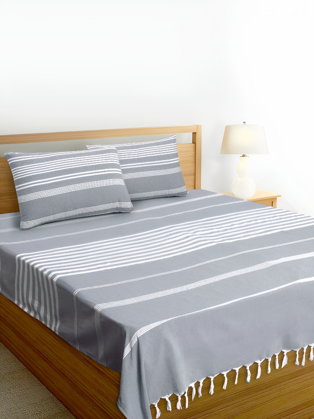 Aura Grey & White Striped Pure Handloom Cotton with Tassels Thick Yarn 180 TC King Bedsheet with 2 Pillow Covers Set
Aura Grey & White Striped Pure Handloom Cotton with Tassels Thick Yarn 180 TC King Bedsheet with 2 Pillow Covers Set