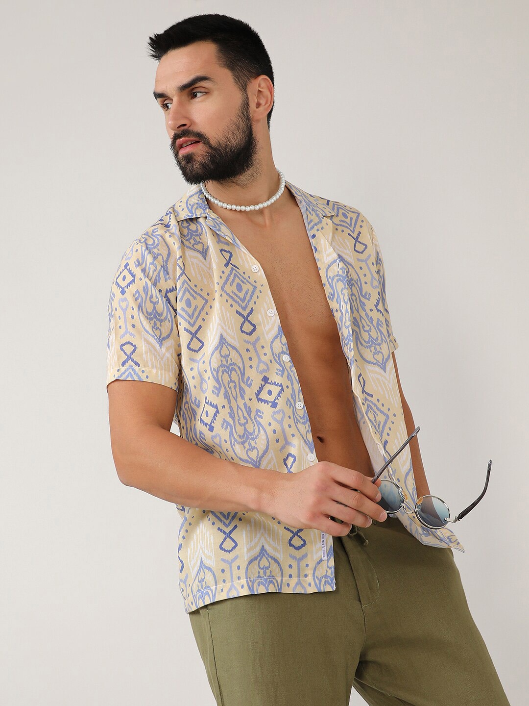 Campus Sutra Beige Classic Ethnic Motifs Printed Cuban Collar Cotton Casual Shirt
Campus Sutra Beige Classic Ethnic Motifs Printed Cuban Collar Cotton Casual Shirt