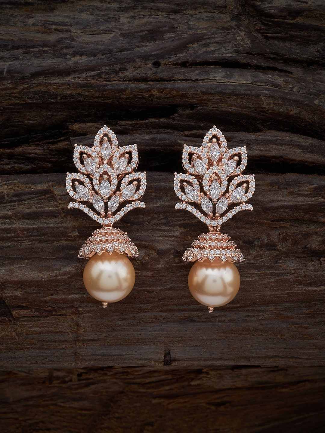 Kushal's Fashion Jewellery Rose Gold-Plated Cubic Zirconia Studded Dome Shaped Jhumkas
Kushal's Fashion Jewellery Rose Gold-Plated Cubic Zirconia Studded Dome Shaped Jhumkas