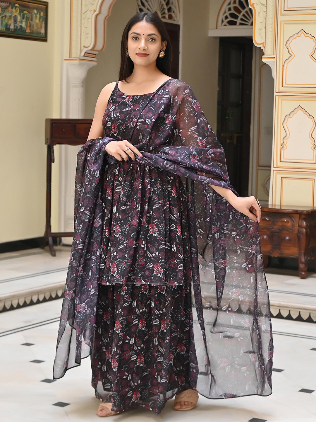 Peachmode Shoulder Straps Sleeveless Floral Printed Anarkali Kurta with Sharara & Dupatta, Black
Peachmode Shoulder Straps Sleeveless Floral Printed Anarkali Kurta with Sharara & Dupatta, Black