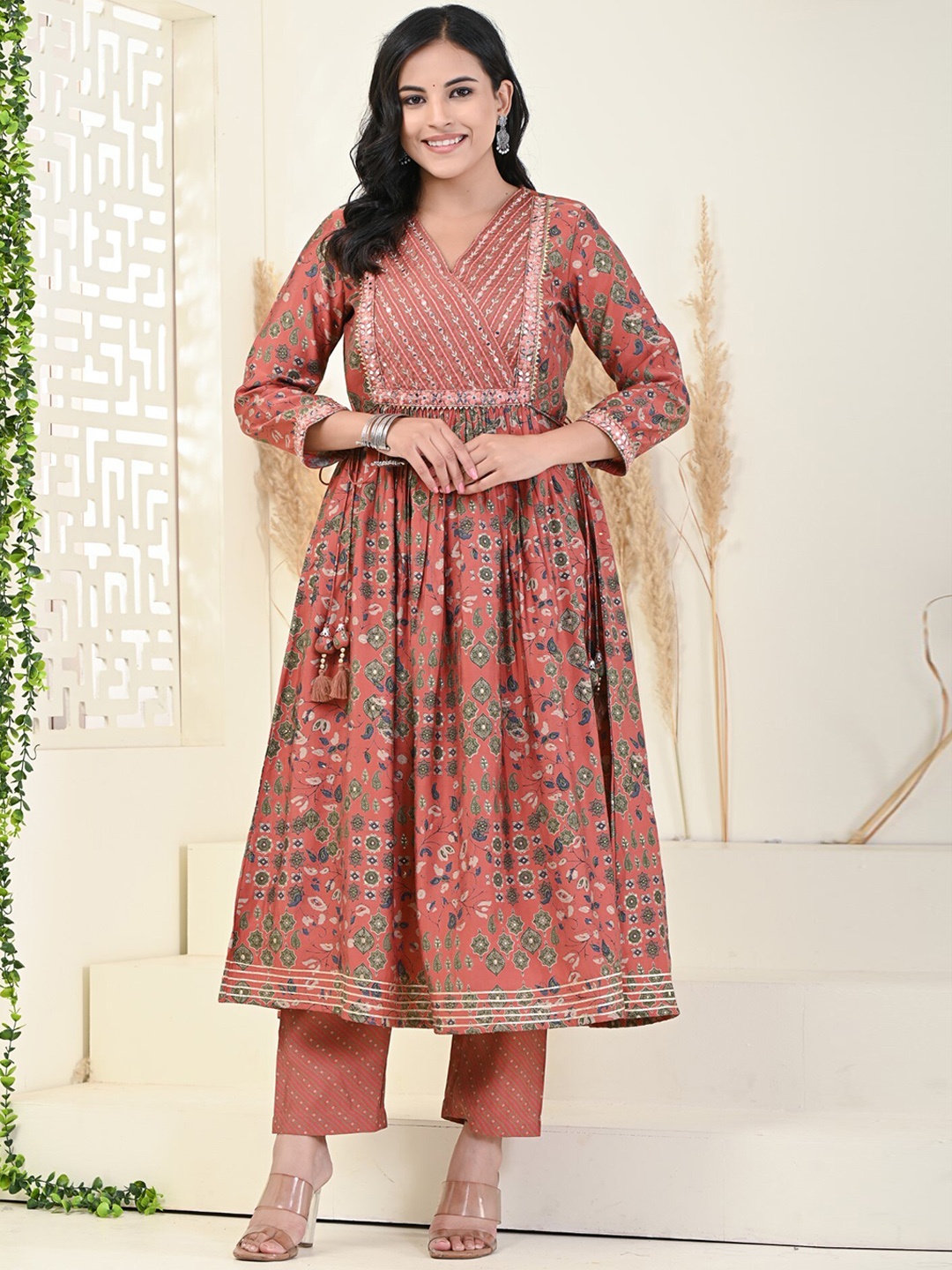 KALINI Floral Embroidered Empire Mirror Work Pure Cotton Anarkali Kurta With Trousers, Rust
KALINI Floral Embroidered Empire Mirror Work Pure Cotton Anarkali Kurta With Trousers, Rust