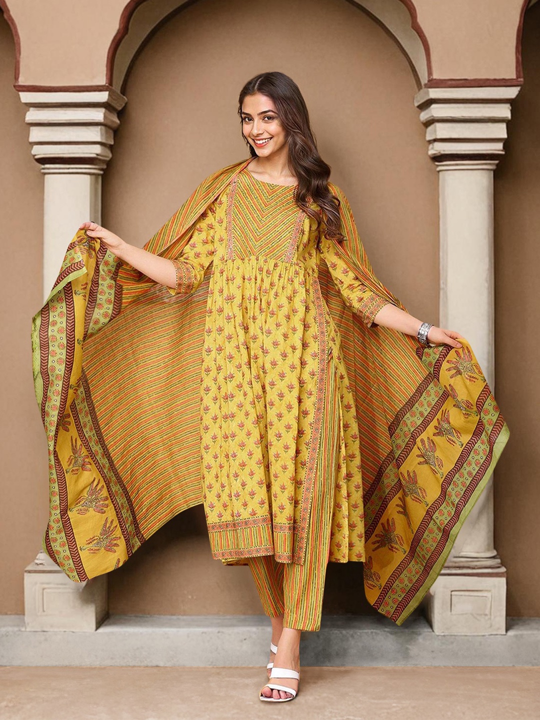 Ishin Women Ethnic Motifs Printed Regular Pure Cotton Kurta with Trousers & Dupatta, Mustard
Ishin Women Ethnic Motifs Printed Regular Pure Cotton Kurta with Trousers & Dupatta, Mustard