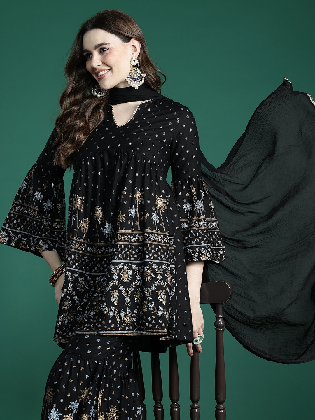 Sangria Women Floral Foil Printed Empire Kurta with Sharara & Dupatta, Black
Sangria Women Floral Foil Printed Empire Kurta with Sharara & Dupatta, Black